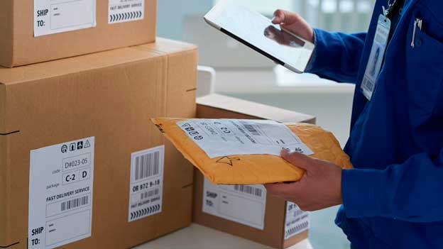 A man checking mail packs