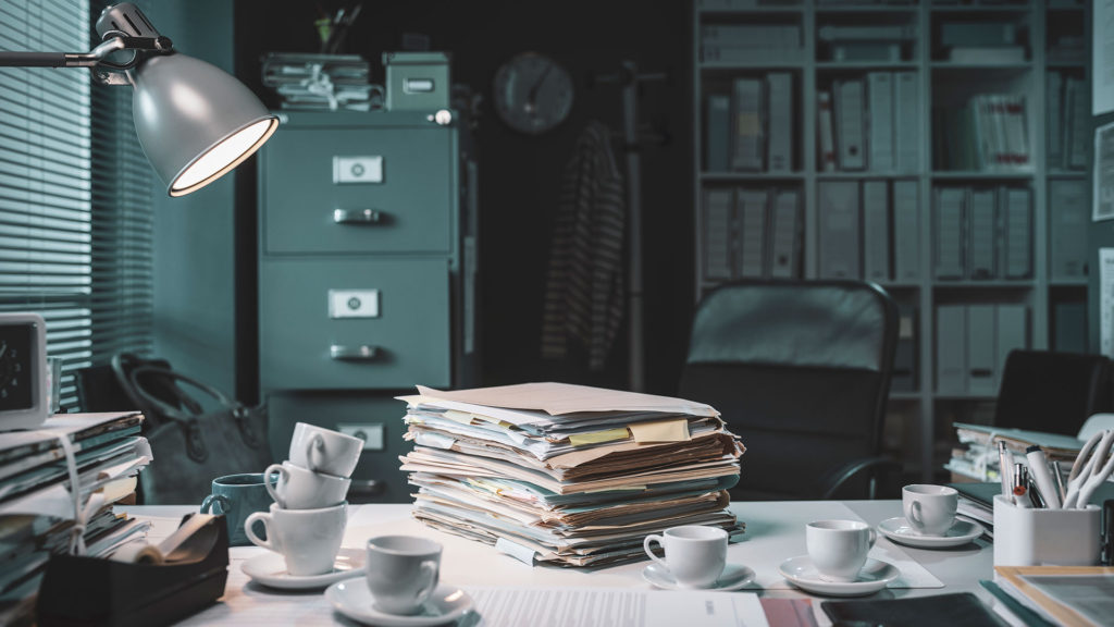 A pile of reports on a desk