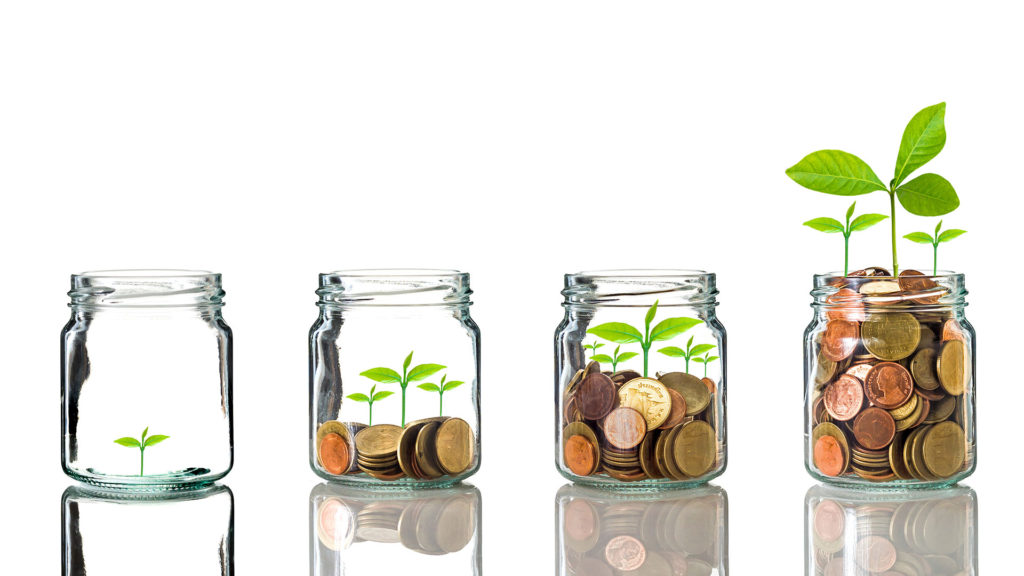 4 jars full of coin with a plant sprout being born