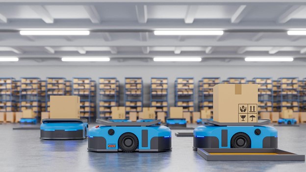 Image 3 - Interior of a warehouse in logistic center with some robots cars carrying delivery boxes