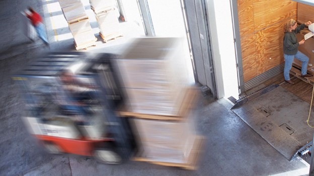 Pallet Stacker running through a wharehouse
