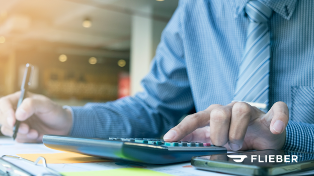 A man using a calculator